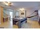 Finished basement with pool table, dart board, basketball hoop, and seating at 317 Lucan Way, Riverdale, GA 30274