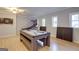 Well-lit game room with a pool table, entertainment options, and sleek hardwood floors at 317 Lucan Way, Riverdale, GA 30274