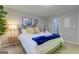 Bedroom featuring a large bed, decorative pillows, and ensuite bathroom at 317 Lucan Way, Riverdale, GA 30274