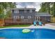 Backyard view featuring in-ground pool, deck, and lounge chairs; perfect for relaxing and entertaining at 317 Lucan Way, Riverdale, GA 30274