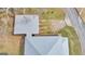 An aerial view shows the home's roof, a large covered outdoor area, and its proximity to the road and surrounding landscape at 1616 Park Ne St, Conyers, GA 30012