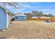 Full backyard with fence, a firepit, shed, and plenty of lawn at 1616 Park Ne St, Conyers, GA 30012