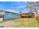 Rear exterior view of home showing fenced yard and covered parking at 1616 Park Ne St, Conyers, GA 30012
