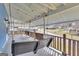 Relaxing covered porch with a swing, wood railing and string lights at 1616 Park Ne St, Conyers, GA 30012