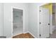 Hallway showcases two doorways and laminate flooring and neutral paint at 1616 Park Ne St, Conyers, GA 30012