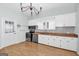 Bright kitchen with white cabinets, wood countertops, stainless steel appliances, and a chandelier at 1616 Park Ne St, Conyers, GA 30012