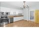 Bright kitchen featuring white cabinets, stainless steel appliances, wood countertop, and chandelier at 1616 Park Ne St, Conyers, GA 30012