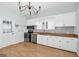 Bright kitchen with white cabinets, butcher block countertops, and stainless steel appliances at 1616 Park Ne St, Conyers, GA 30012