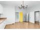 Open kitchen area with stainless steel refrigerator and view to additional rooms at 1616 Park Ne St, Conyers, GA 30012