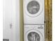 Modern laundry area with stacked washer and dryer, ideal for efficient space utilization and convenience at 1616 Park Ne St, Conyers, GA 30012