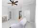 Bright living room with white painted floors, fireplace, and ceiling fan, offering a fresh and inviting space at 1616 Park Ne St, Conyers, GA 30012