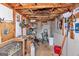 Interior of a shed with exposed rafters and a sink with various storage items and tools at 1616 Park Ne St, Conyers, GA 30012