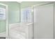 Bathroom featuring a soaking tub and separate glass enclosed shower at 3867 Summer Kitchen Way, Lilburn, GA 30047