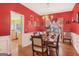 Dining room with wainscoting, decorative lighting, and an exquisite dining table set at 3867 Summer Kitchen Way, Lilburn, GA 30047