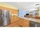 Spacious kitchen with island, stainless steel refrigerator, and open layout at 3867 Summer Kitchen Way, Lilburn, GA 30047