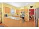 Bright kitchen with wooden cabinets, granite countertops, stainless steel appliances at 3867 Summer Kitchen Way, Lilburn, GA 30047