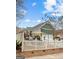Exterior of the home showing a fenced backyard with a patio and outdoor seating area at 155 Stayman Park, Fayetteville, GA 30215