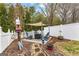 Backyard lounge area featuring comfortable seating, shade, and attractive landscaping at 155 Stayman Park, Fayetteville, GA 30215