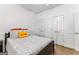 Bedroom with a bed, carpeted floor and two white closet doors at 155 Stayman Park, Fayetteville, GA 30215
