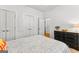 Bedroom featuring two closets, a black dresser, and a patterned bedspread at 155 Stayman Park, Fayetteville, GA 30215