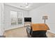 Cozy bedroom with a ceiling fan, chair, television, and carpeted floor at 155 Stayman Park, Fayetteville, GA 30215