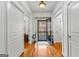 Bright foyer with hardwood floors, white trim, and an open doorway to the outside at 155 Stayman Park, Fayetteville, GA 30215