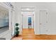 Bright foyer with wood floors, white walls and trim, and an arched doorway view to the bathroom at 155 Stayman Park, Fayetteville, GA 30215