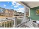 Relaxing covered front porch offers neighborhood views, seating, and a peaceful outdoor space at 155 Stayman Park, Fayetteville, GA 30215