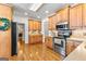 Charming kitchen featuring stainless steel appliances and wooden cabinetry at 155 Stayman Park, Fayetteville, GA 30215