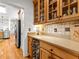 Kitchen with wood cabinets, countertop lighting, stainless steel appliances, and hardwood floors at 155 Stayman Park, Fayetteville, GA 30215