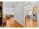 Open-concept living room and dining room with hardwood floors and ample natural light at 155 Stayman Park, Fayetteville, GA 30215