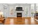 Bright living room showcases a fireplace with modern decor and hardwood flooring at 155 Stayman Park, Fayetteville, GA 30215