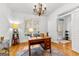 Office with wood floors, natural light and a desk with a lamp and flowers at 155 Stayman Park, Fayetteville, GA 30215
