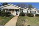 Charming one story home with an inviting front porch and simple landscaping at 133 Dove Lndg, Social Circle, GA 30025