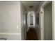 Hallway featuring neutral walls and multiple entryways, connecting various spaces at 133 Dove Lndg, Social Circle, GA 30025