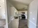 Well-lit kitchen featuring white cabinetry, modern appliances, and light countertop at 133 Dove Lndg, Social Circle, GA 30025