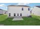 Exterior view of the home featuring a flat backyard at 106 Cowpen Ct, Walnut Grove, GA 30052