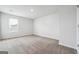 Cozy bedroom with neutral carpet, white walls, and a window with horizontal blinds at 106 Cowpen Ct, Walnut Grove, GA 30052