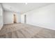 Bright bedroom with neutral walls, soft carpet, and multiple doorways at 106 Cowpen Ct, Walnut Grove, GA 30052