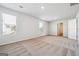 Spacious bedroom with plush carpeting, neutral walls, and natural light from large windows at 106 Cowpen Ct, Walnut Grove, GA 30052