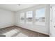 Bedroom with 3 large windows overlooking the neighborhood, allowing natural light to fill the space at 106 Cowpen Ct, Walnut Grove, GA 30052