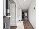 Open foyer with wood-look flooring leading to the kitchen at 106 Cowpen Ct, Walnut Grove, GA 30052