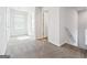 Upstairs hall with carpet flooring and natural light at 106 Cowpen Ct, Walnut Grove, GA 30052