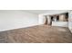 Expansive living room with wood-look floors open to the kitchen at 106 Cowpen Ct, Walnut Grove, GA 30052