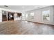 Open-concept living room with stainless steel appliances, and wood-look floors at 106 Cowpen Ct, Walnut Grove, GA 30052