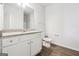 Well-lit bathroom features granite countertops, white cabinets, chrome fixtures, and hardwood floors at 604 Clark Lake Estates Dr, Grayson, GA 30017