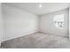 Neutral bedroom with natural light and neutral carpet at 604 Clark Lake Estates Dr, Grayson, GA 30017
