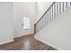 Inviting foyer with hardwood floors, a staircase, and a storm door floods the space with natural light at 604 Clark Lake Estates Dr, Grayson, GA 30017