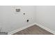 Laundry room with hookups for washer and dryer and neutral flooring at 604 Clark Lake Estates Dr, Grayson, GA 30017