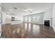 Bright open concept, with fireplace, hardwood floors, a ceiling fan and views to the kitchen at 604 Clark Lake Estates Dr, Grayson, GA 30017
